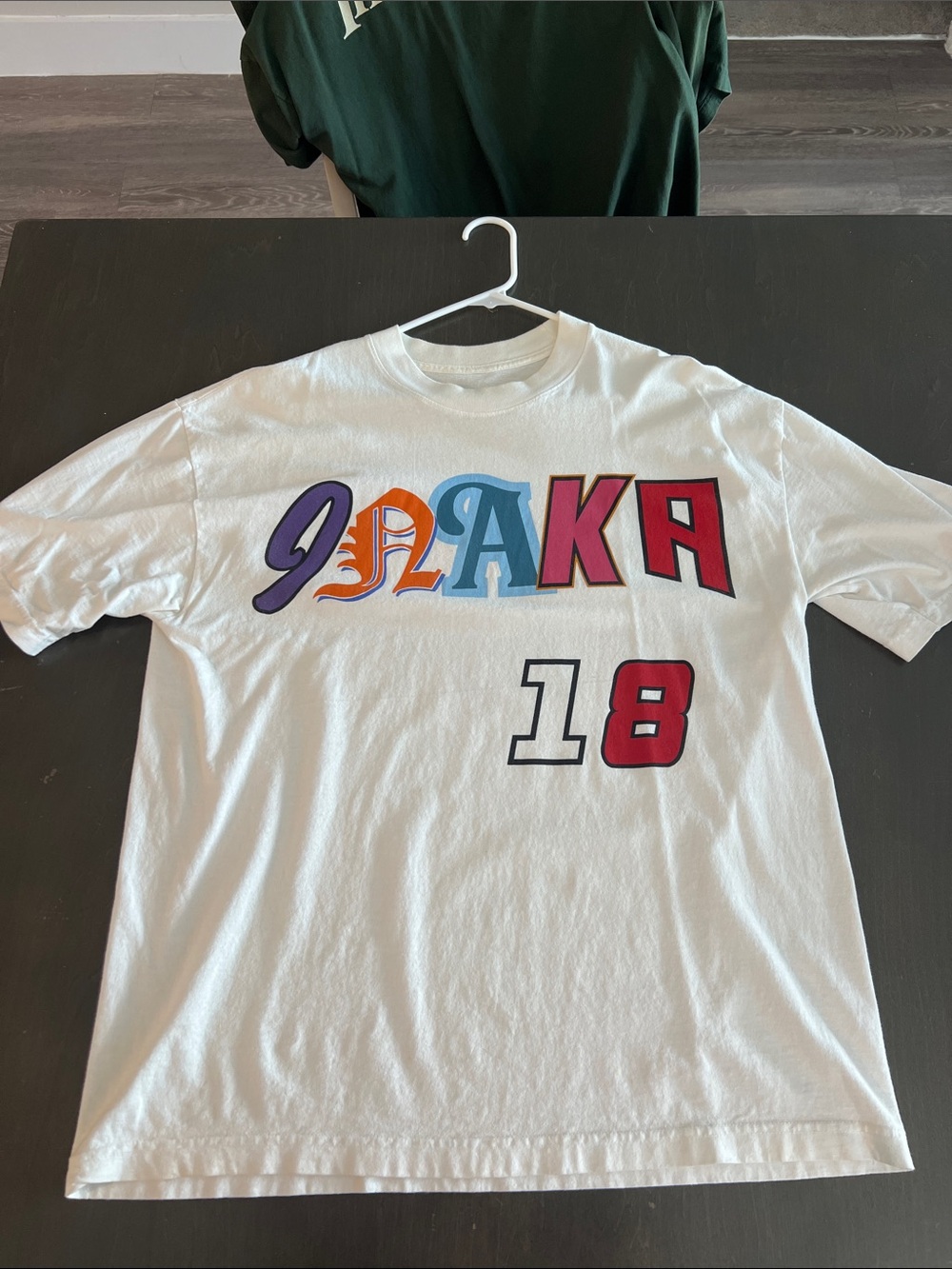 Inaka Power White Graphic Tee with Multicolor Lettering and Red '18'